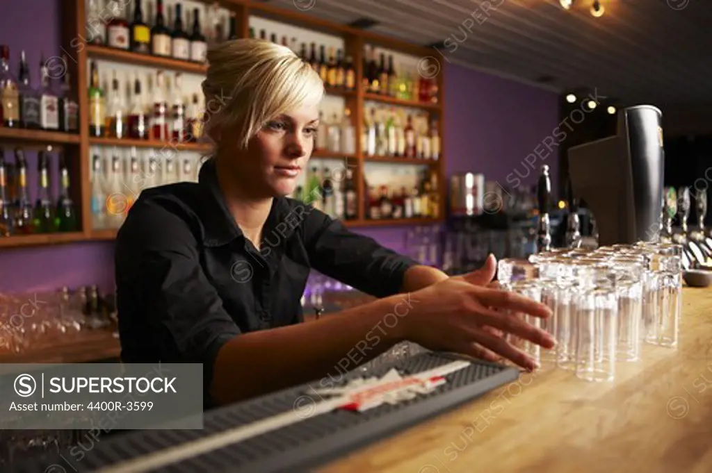 Young Scandinavian female bartender, Sweden.