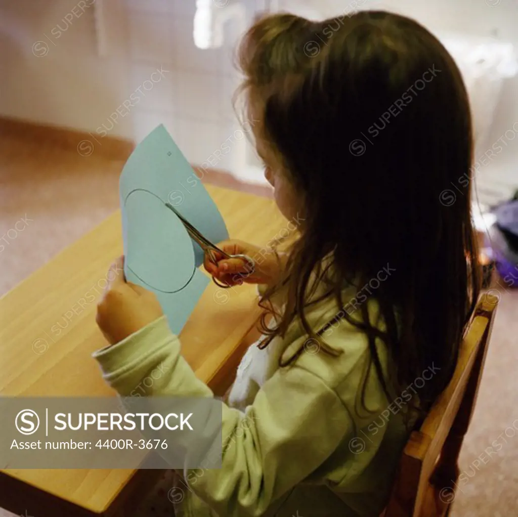 Girl cutting paper