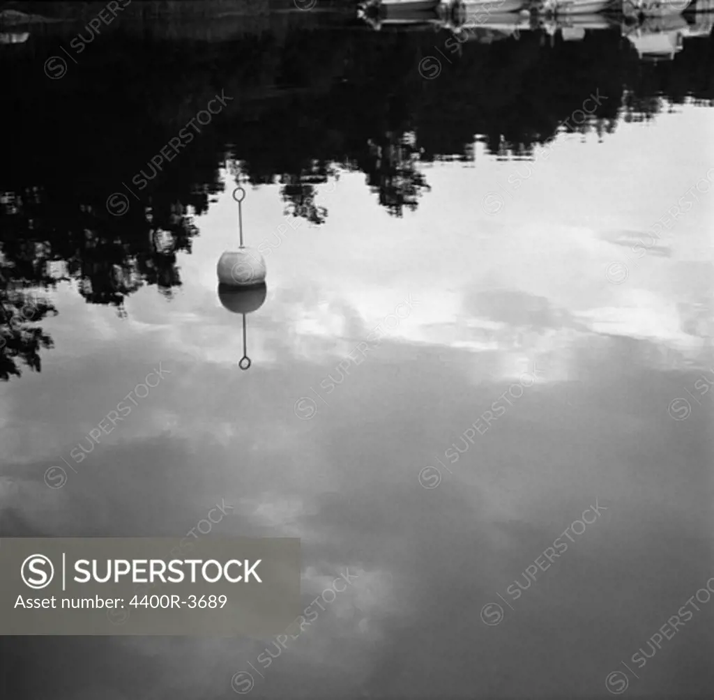 A buoy in still water, Sweden.