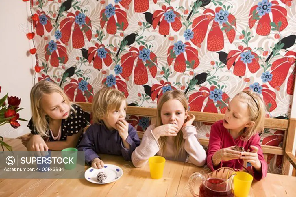 Children eating cookies, Sweden.