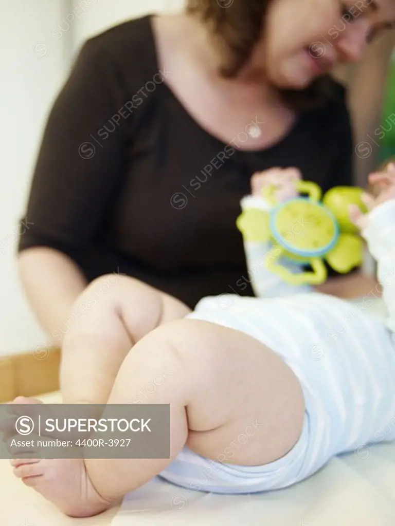 A midwife measuring a baby.