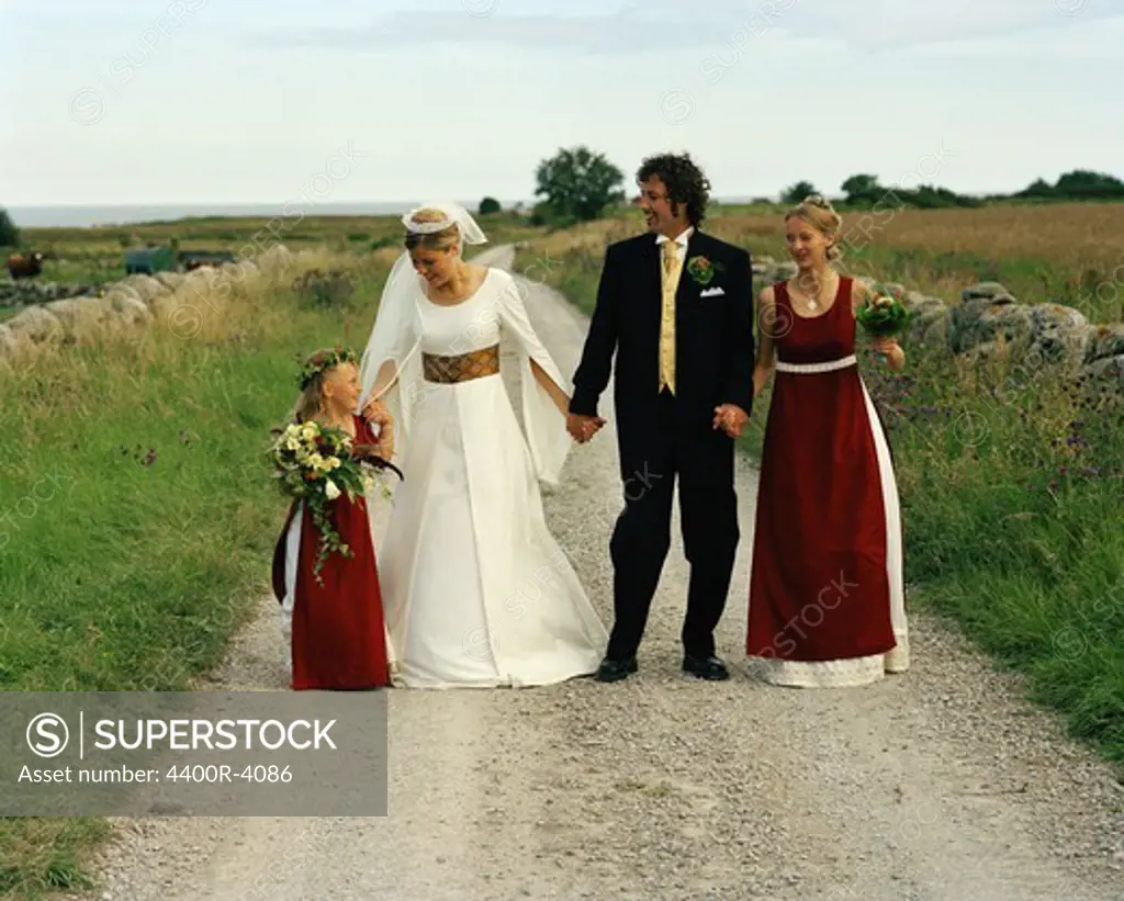 Scandinavia, Sweden, Oland, Bride and groom with bridesmaid and flower girl