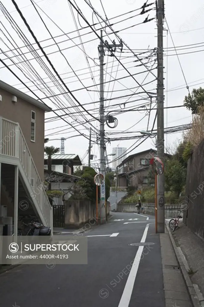 Electric cables over a street, Japan.