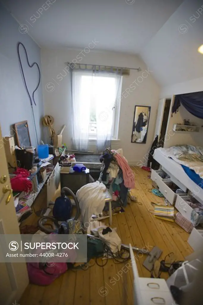 Messy bedroom with scattered items
