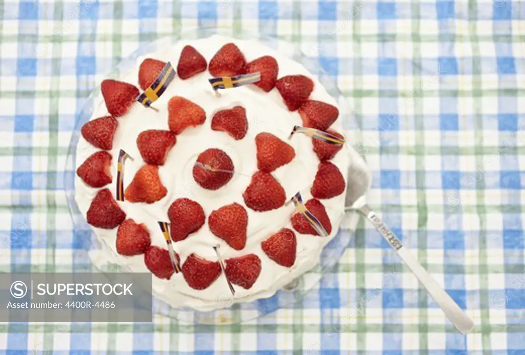 Strawberry cake on table