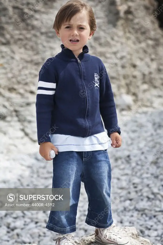 Boy standing on quarry, portrait
