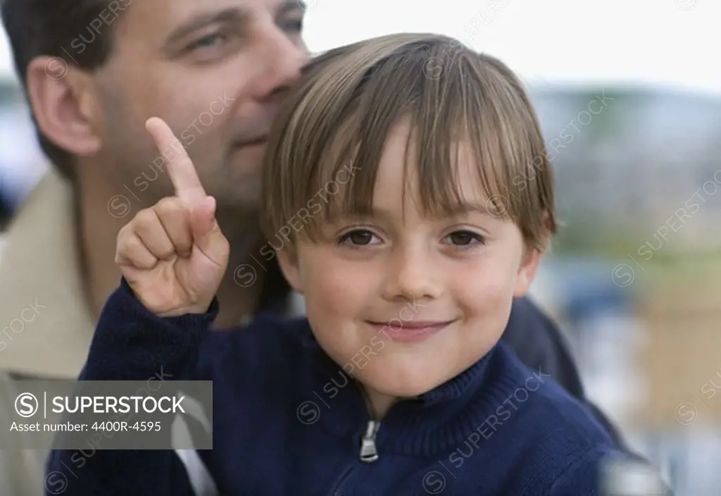 Boy with father, smiling