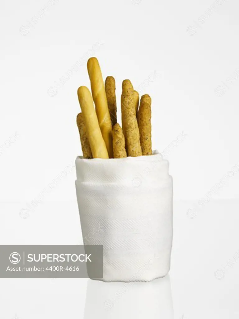 Breadsticks wrapped in napkin paper