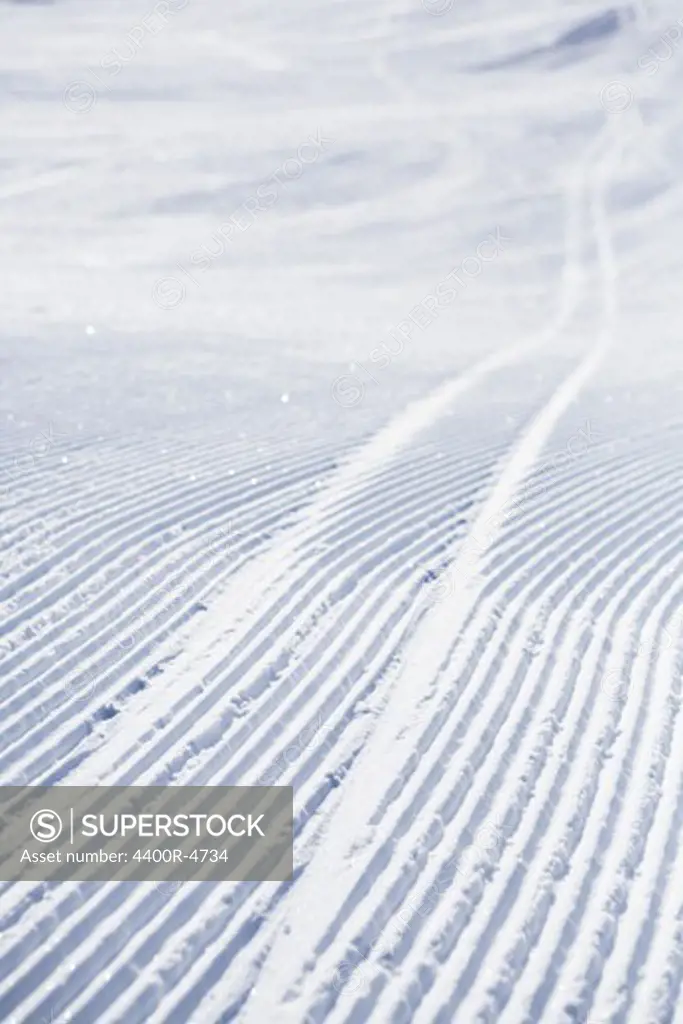 Ski track through snow