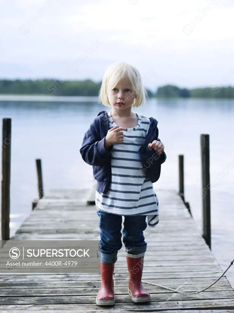 Portrait of girl standing on jetty