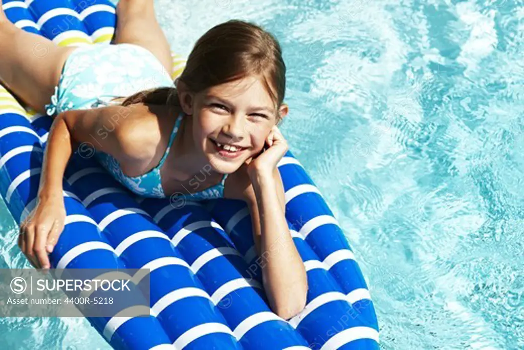 Portrait of girl on pool raft