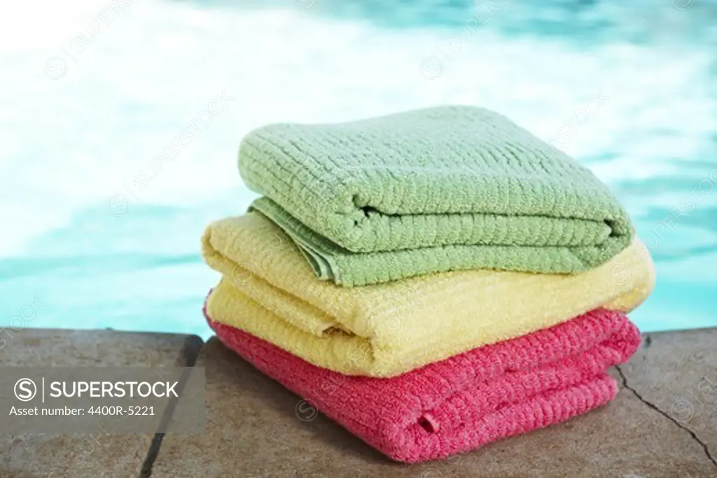 Stack of towels at poolside