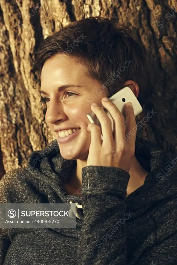Portrait of young woman talking on cell phone