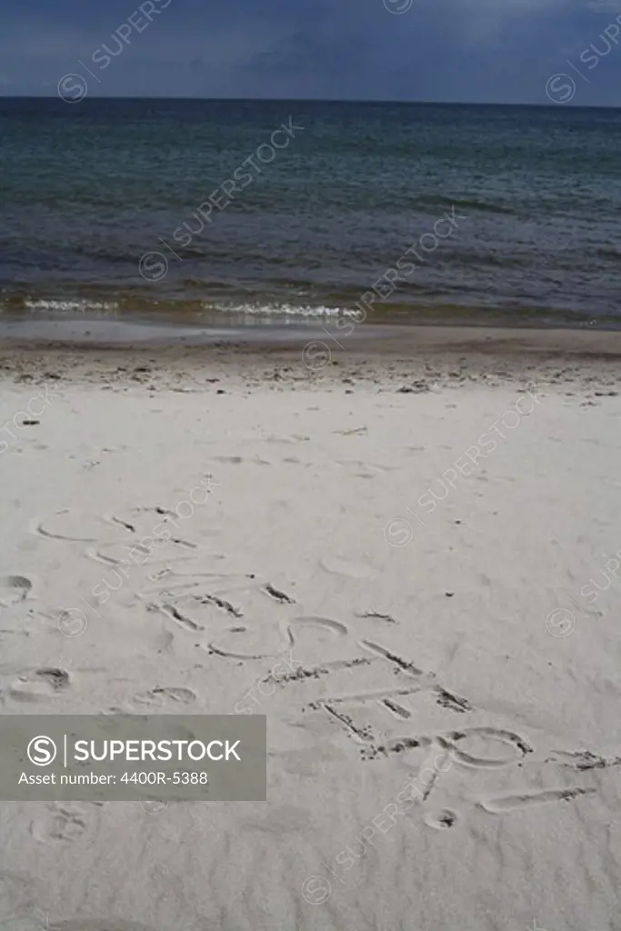 Text in the sand, Oland, Sweden.