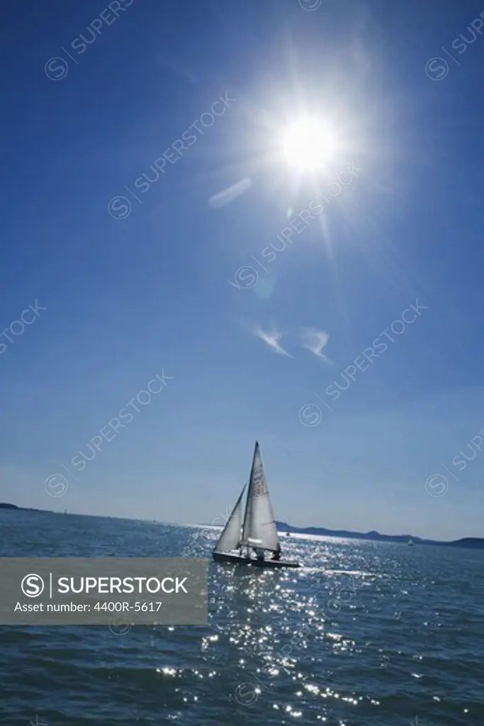 A salingboat under the sun.