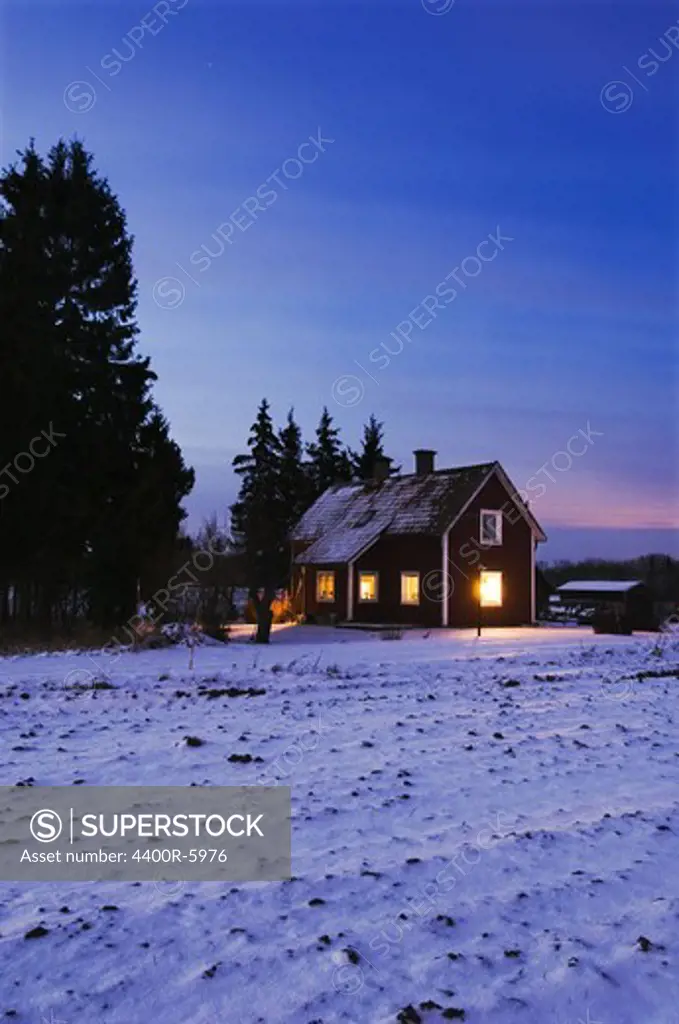A cottage a winter night, Sweden.