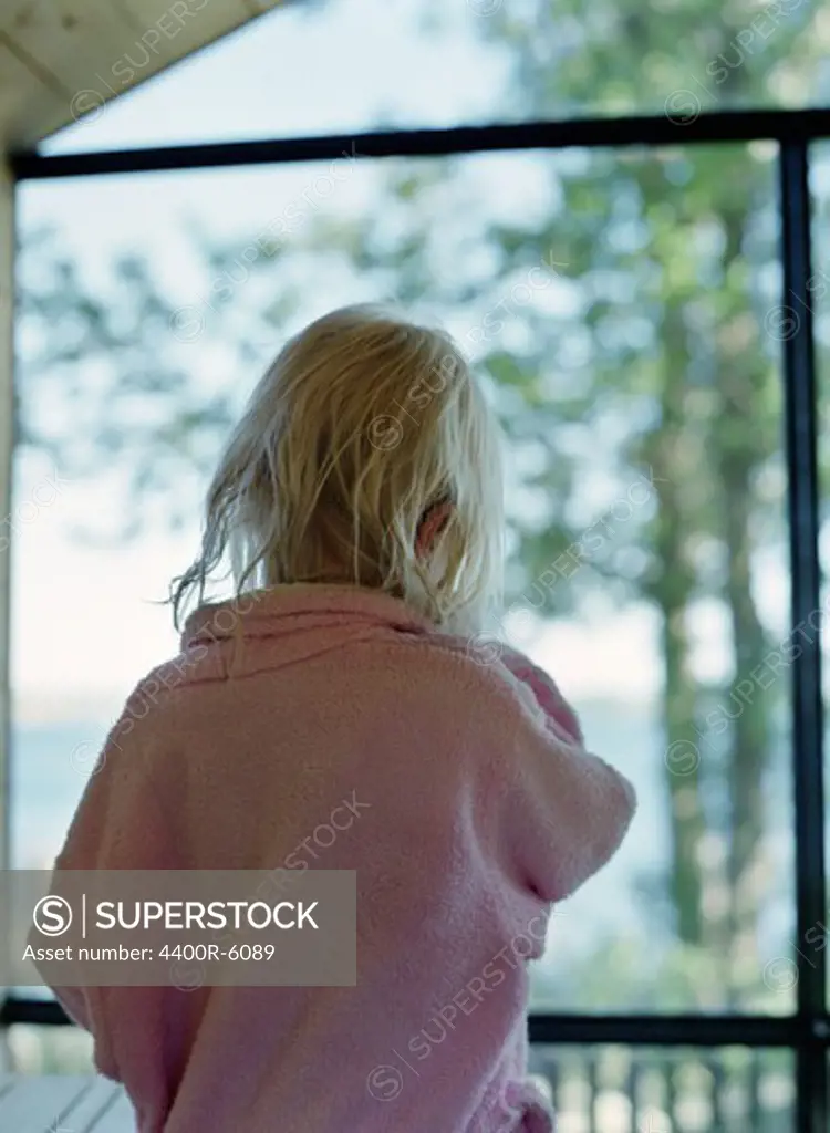 A girl wearing a bathrobe, Blekinge, Sweden.