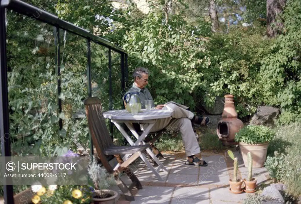 A man sitting in a garden, Sweden.
