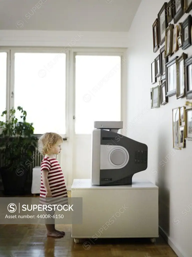 A little girl watching TV, Sweden.