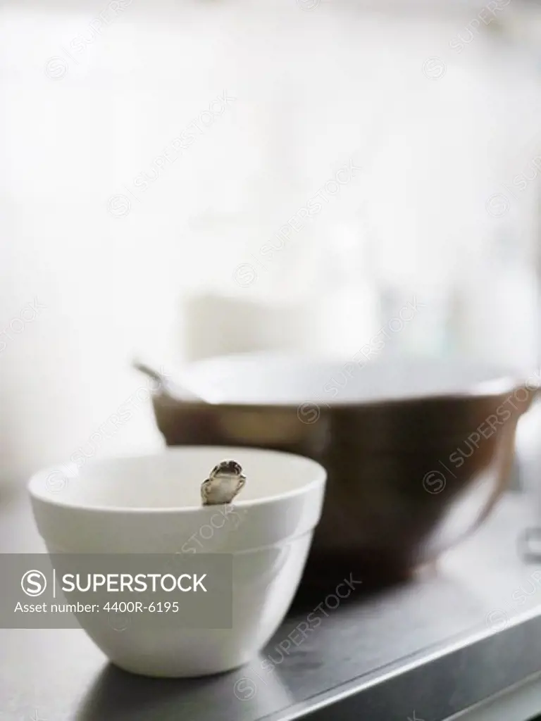 Two bowls on a kitchen worktop.