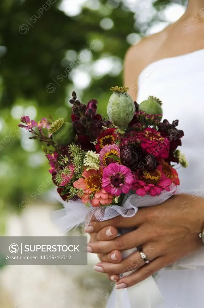 A bride holding a wedding bouquet, Sweden.