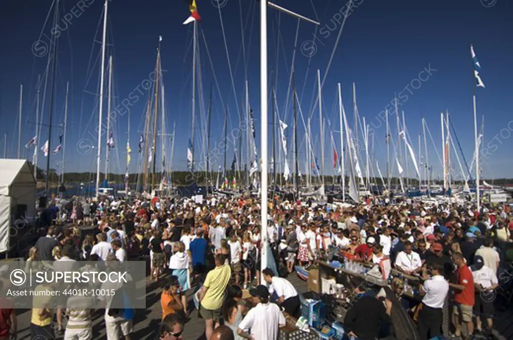 Crowd of people before the beginning of a sailing competition, Sandhamn, Stockholm archipelago, Sweden.