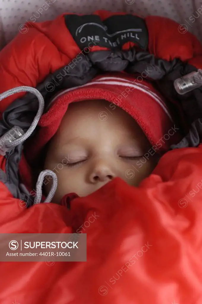 Girl sleeping in a sleeping-bag, Sweden.