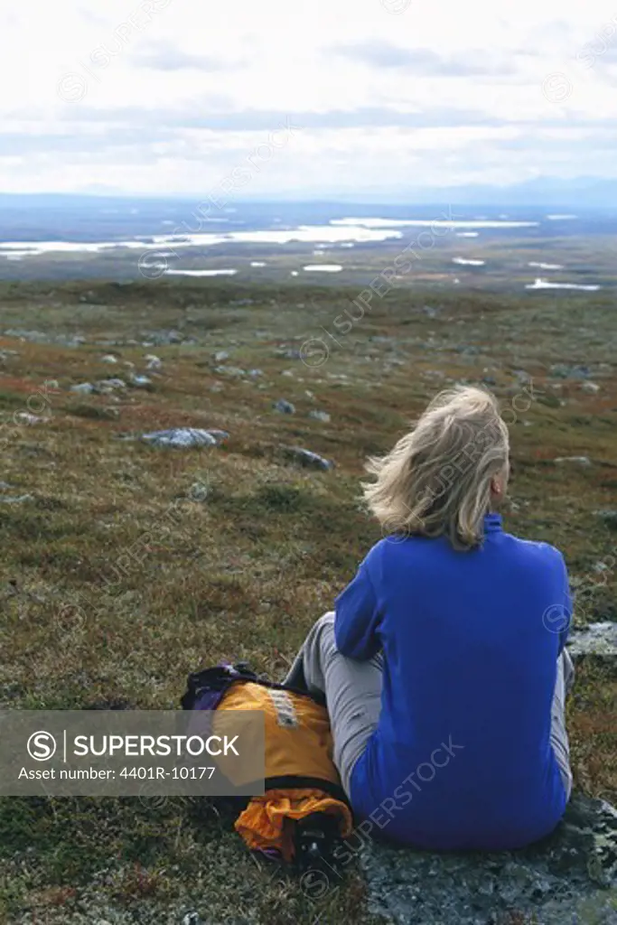 Woman enjoying a mountain scenery, Sweden.