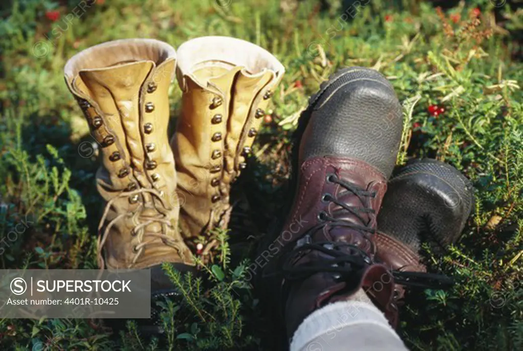 Hiking boots on grass, Sweden.