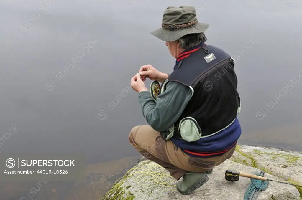 A man fly fishing, Smaland, Sweden.