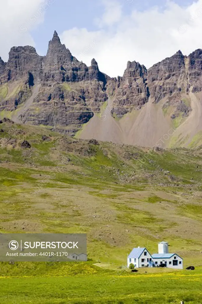 Houses in mountain landscape, Iceland.