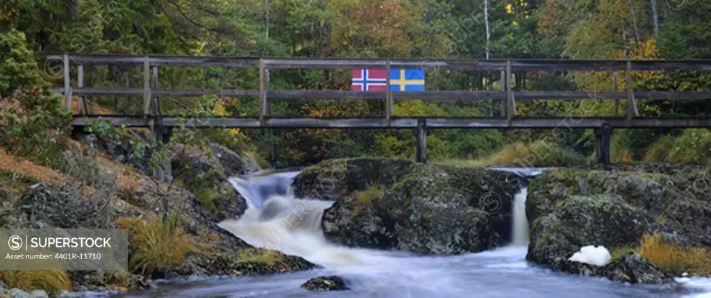 Scandinavia, Norway, Sweden, Bohuslan, View of flowing water with bridge