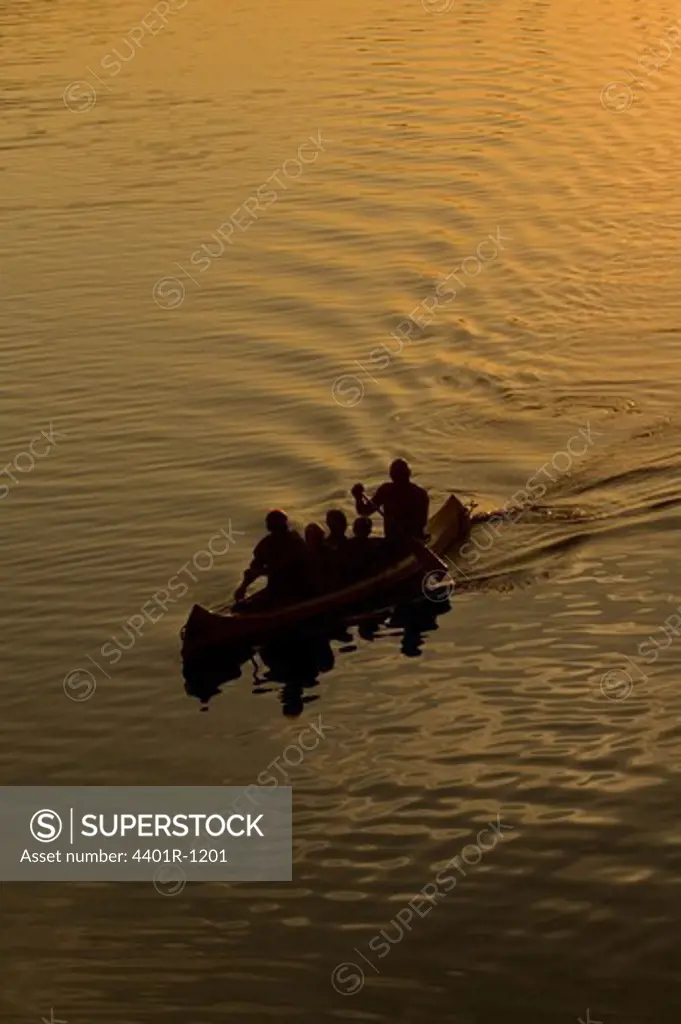 Five people canoeing, Ostergotland, Sweden.
