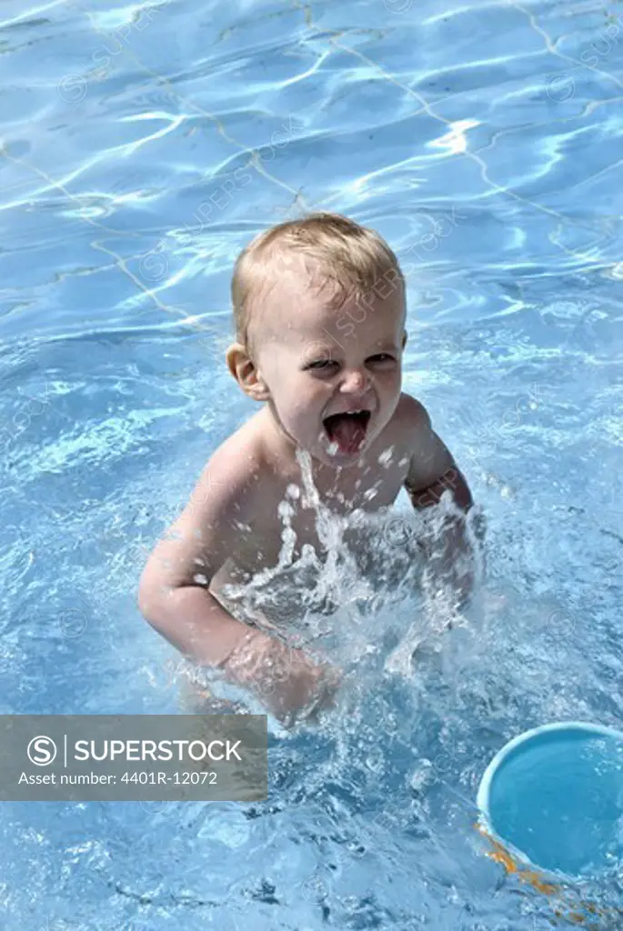 A young boy in a pool