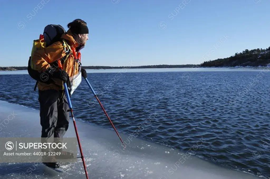 A man by the edge of the ice