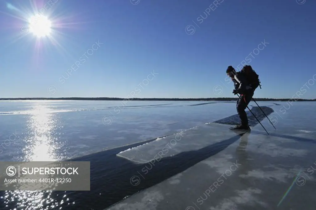 A man ice skating on melting ice