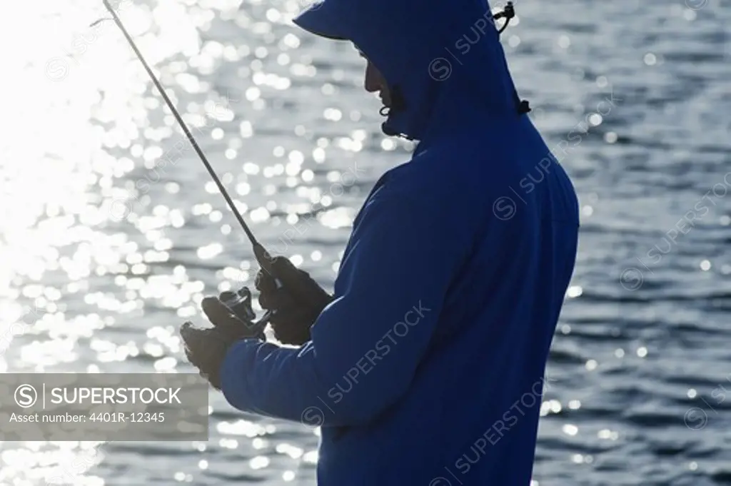 Scandinavia, Sweden, Halland, Man with fishing rod