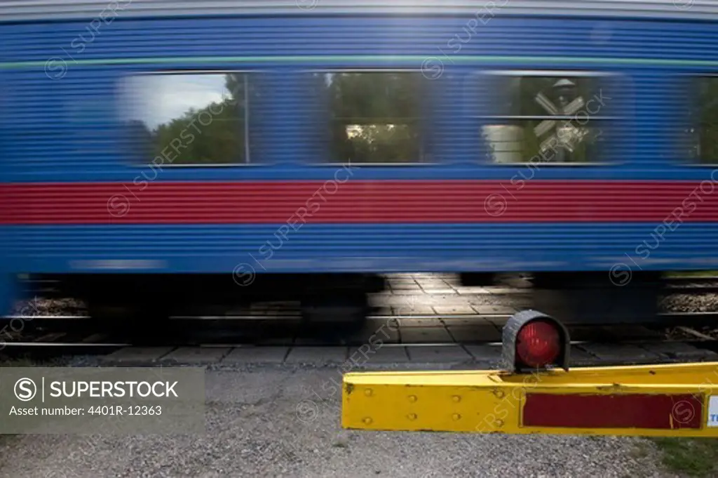 Train speeding through crossing
