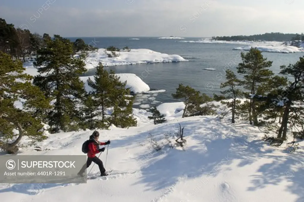 A person skiing in the archipelago of Stockholm, Sweden.