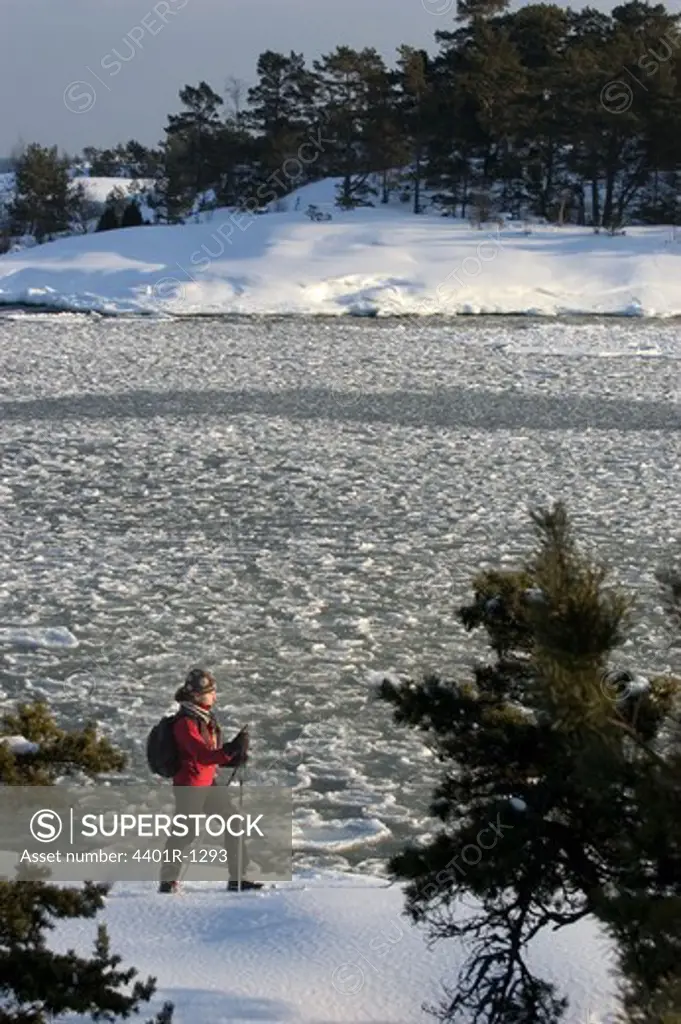 A person skiing in the archipelago of Stockholm, Sweden.