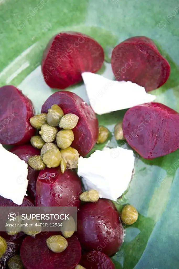 Salad with beetroots, capers and cheese, close-up