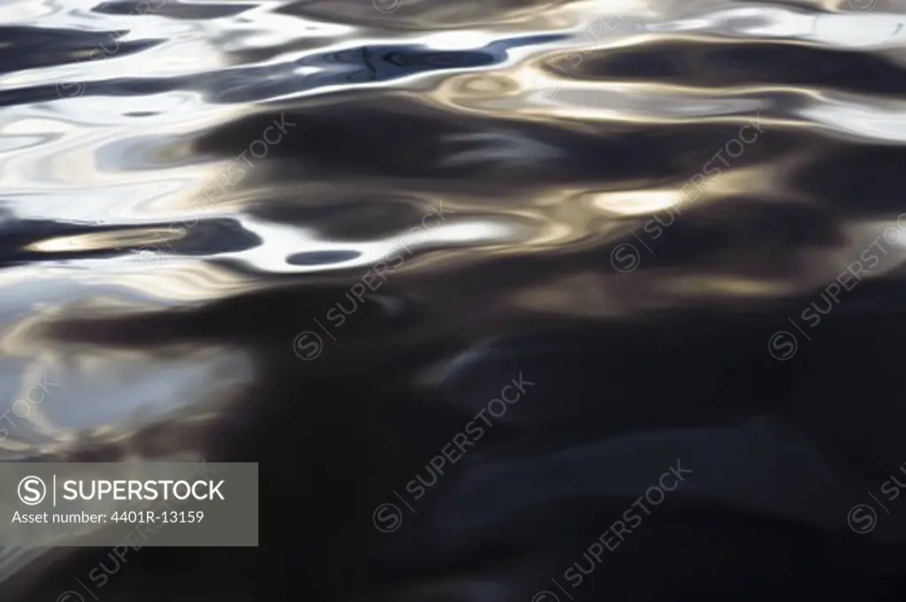 Water surface with sun reflections