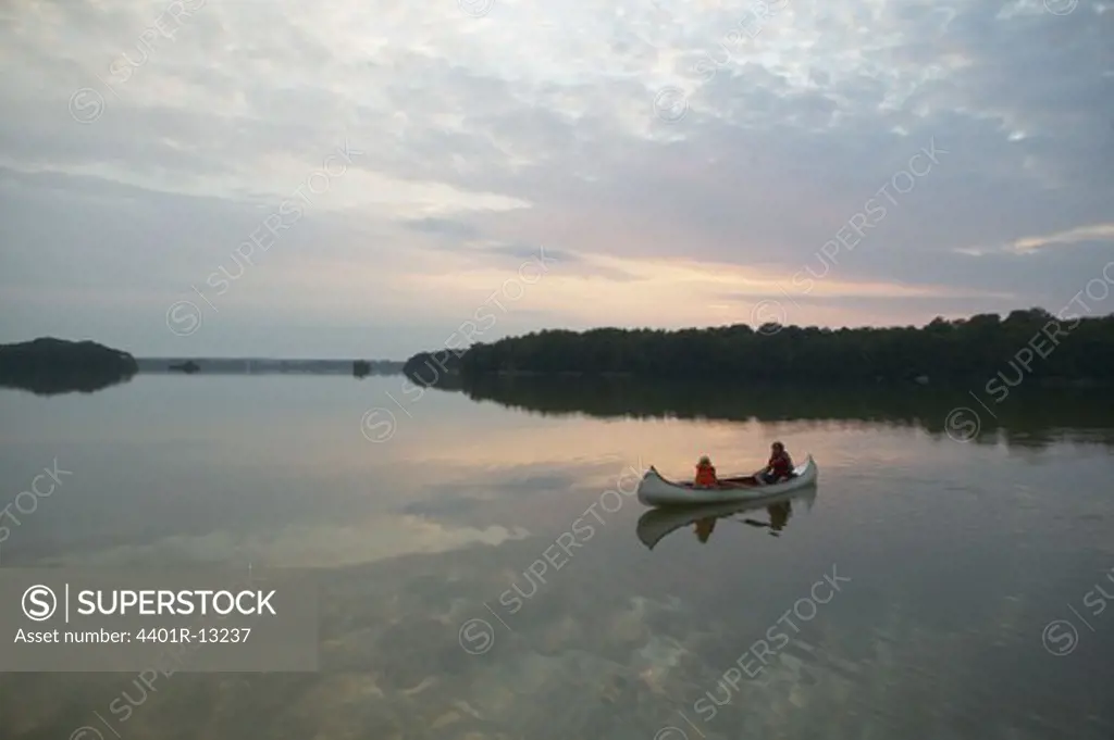 Mother with daughter in rowing boat