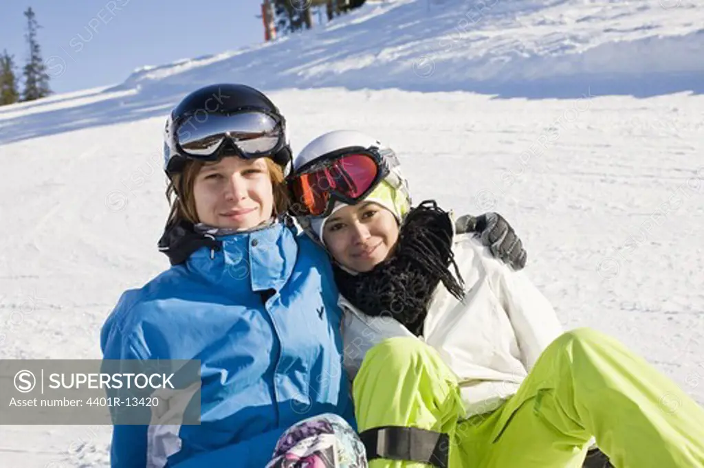 Portrait of young couple in ski suit