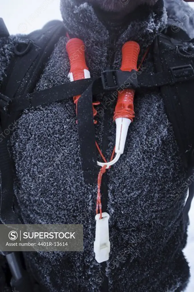 Close-up of climbing equipment on mans chest