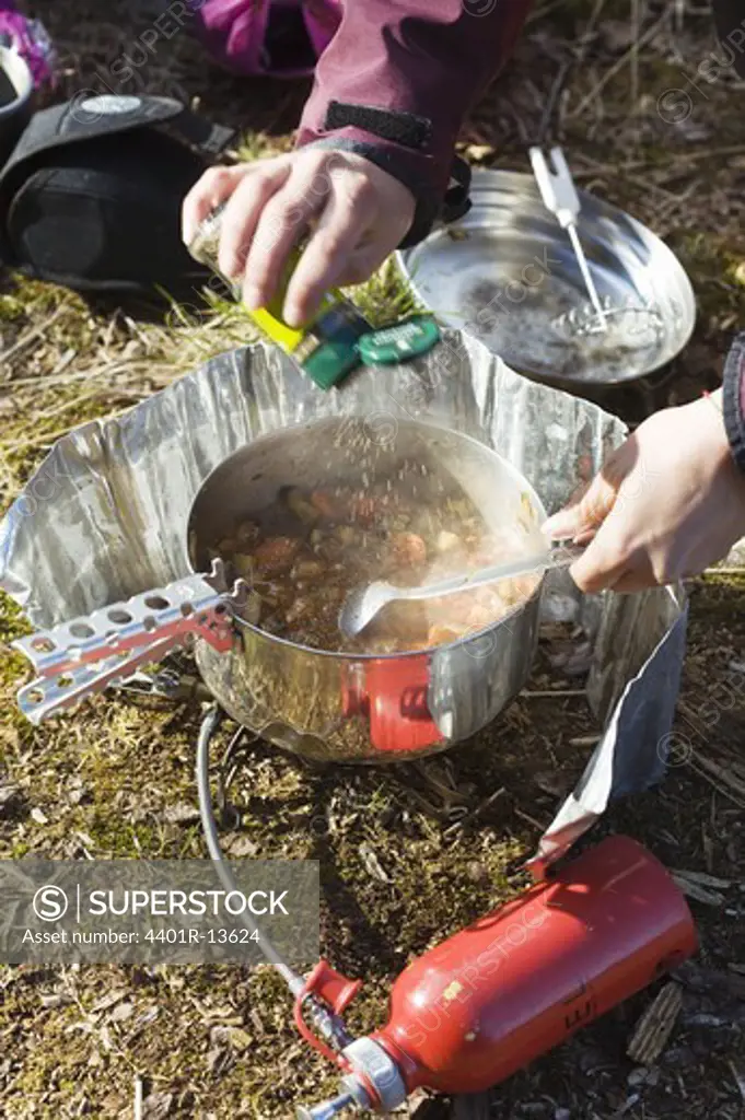 Tourist cooking on camp