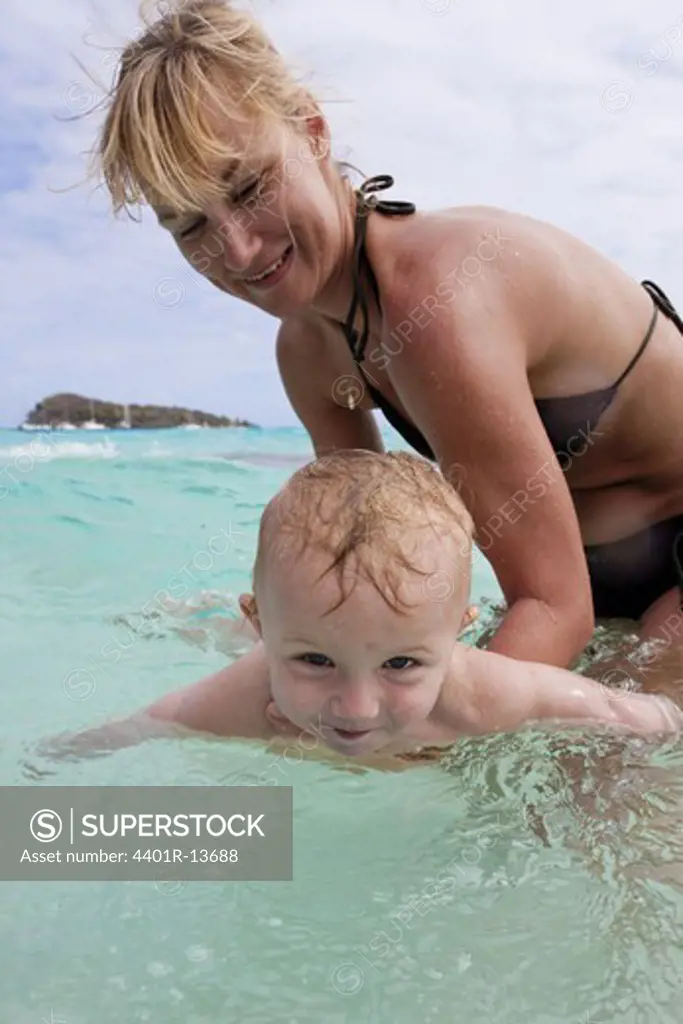 Mother and son playing in Caribbean Sea
