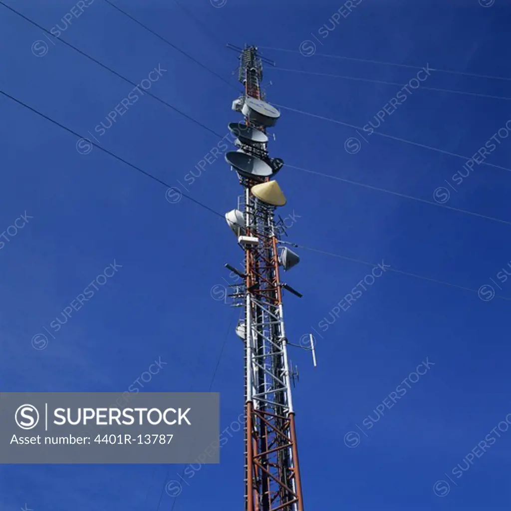 Communication tower against blue sky