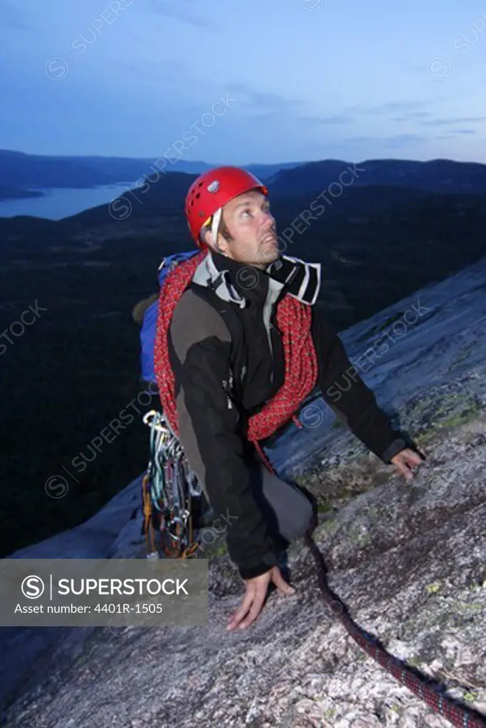 A man climbing a mountain, Norway.