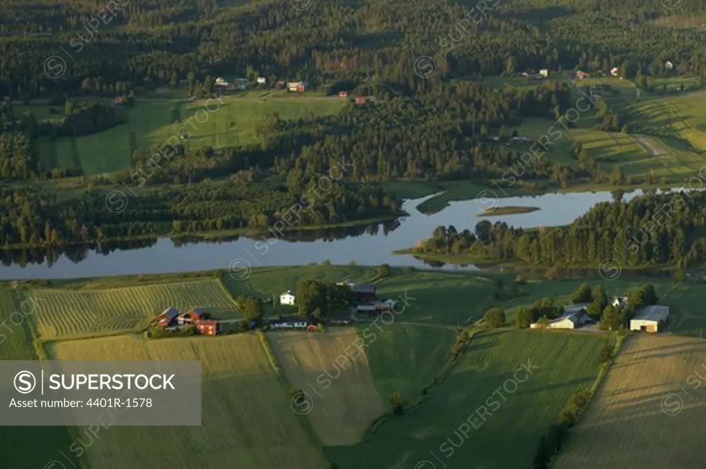 Fields and farms by the river Ljungan, Medelpad, Sweden.